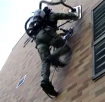 man climbing with vacuum cleaners